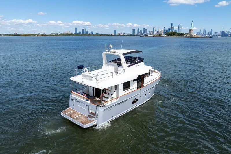 Dreamscape Yacht Photos Pics 2020 Beneteau Swift Trawler 50 cruising near city skyline and Statue of Liberty.
