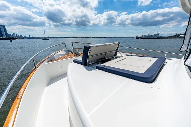 Dreamscape Yacht Photos Pics 2020 Beneteau Swift Trawler 50 on open water, featuring spacious deck and seating.