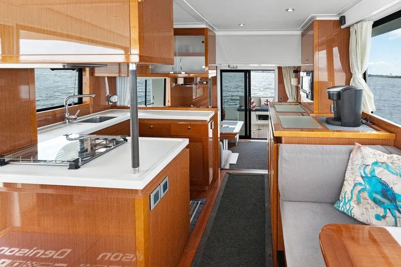 Dreamscape Yacht Photos Pics Interior of 2020 Beneteau Swift Trawler 50, featuring modern kitchen and cozy seating area.