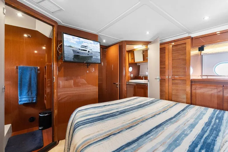 Dreamscape Yacht Photos Pics Luxurious cabin interior of 2020 Beneteau Swift Trawler 50 with wood finishes and modern amenities.