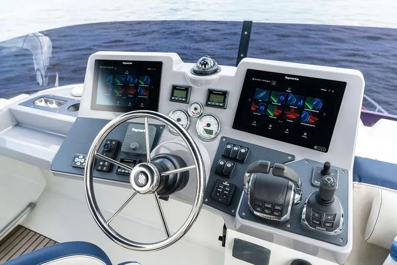 Dreamscape Yacht Photos Pics Cockpit of 2020 Beneteau Swift Trawler 50 with advanced navigation controls and dual displays.