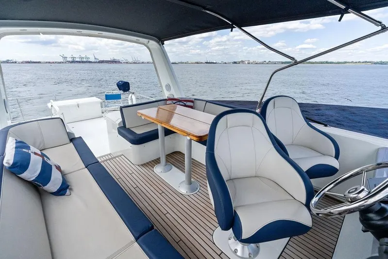 Dreamscape Yacht Photos Pics 2020 Beneteau Swift Trawler 50 interior with seating and ocean view.