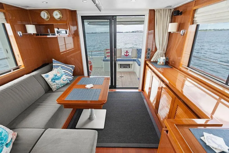 Dreamscape Yacht Photos Pics Luxurious interior of 2020 Beneteau Swift Trawler 50 with ocean view and elegant furnishings.