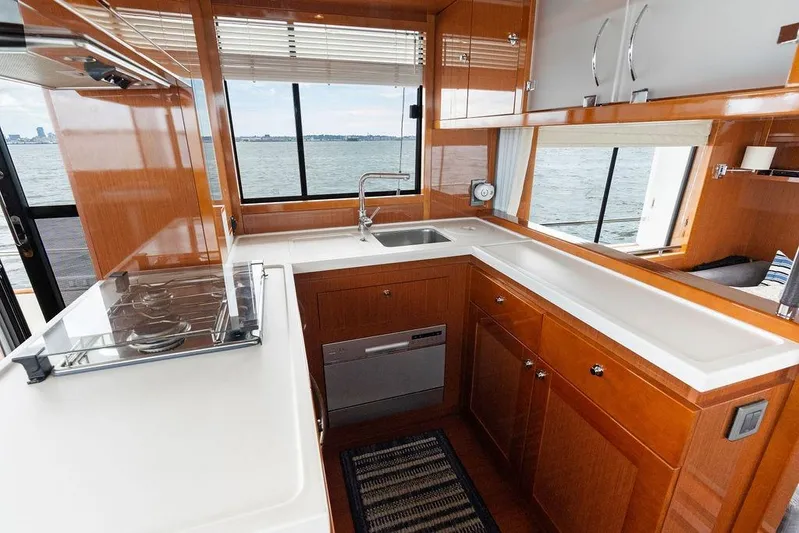 Dreamscape Yacht Photos Pics Modern kitchen interior of 2020 Beneteau Swift Trawler 50 with ocean view.