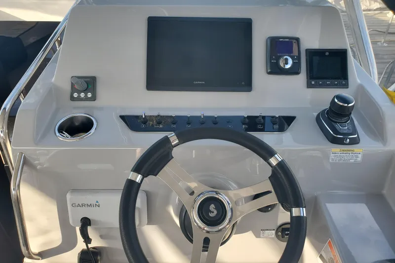  Yacht Photos Pics 2021 Beneteau Flyer 10 helm with Garmin navigation and control systems.