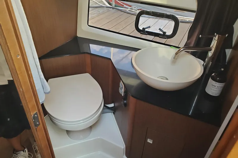  Yacht Photos Pics Modern bathroom in 2021 Beneteau Flyer 10 boat with toilet and sink.