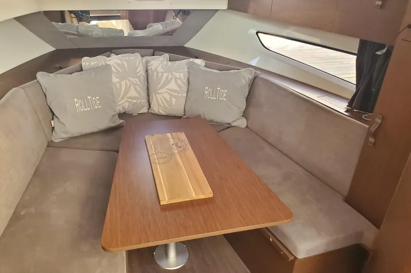  Yacht Photos Pics Interior of 2021 Beneteau Flyer 10 with cozy seating and decorative pillows.