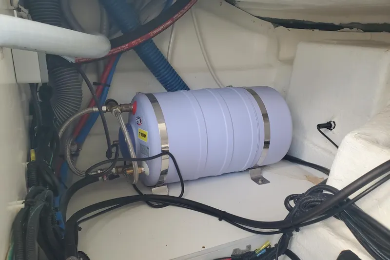  Yacht Photos Pics Engine compartment of 2021 Beneteau Flyer 10 with water heater and wiring.