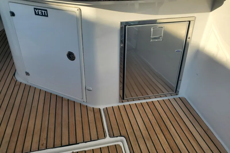  Yacht Photos Pics Teak deck and storage on 2021 Beneteau Flyer 10 boat, featuring Yeti cooler.