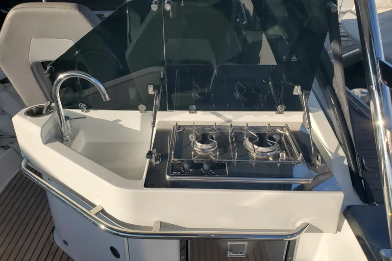  Yacht Photos Pics 2021 Beneteau Flyer 10 boat kitchen with sink and dual-burner stove.