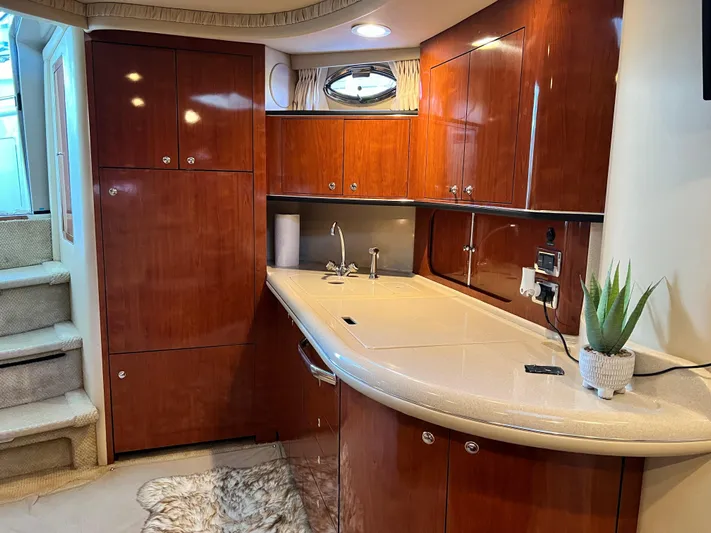 Yacht Photos Pics Luxurious 2003 Sea Ray 460 Sundancer yacht interior with polished wood cabinetry and modern amenities.