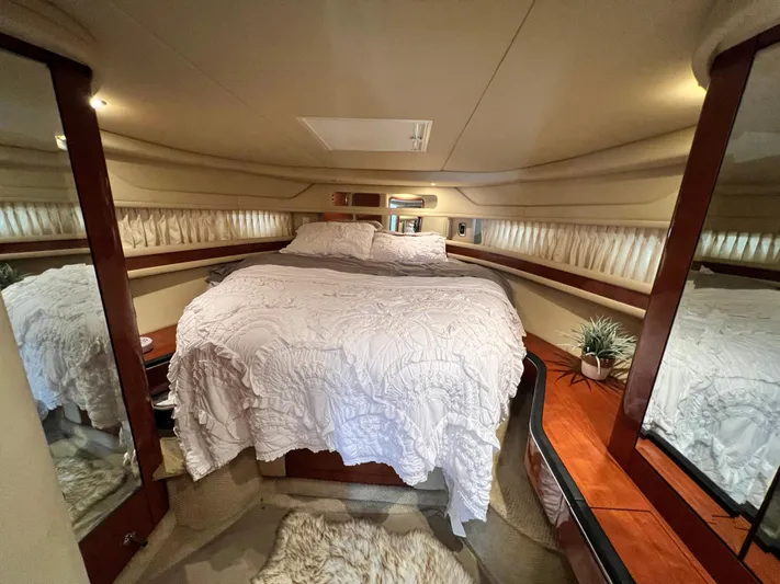  Yacht Photos Pics Luxurious cabin interior of 2003 Sea Ray 460 Sundancer yacht with elegant bedding.