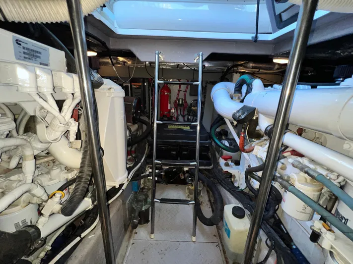  Yacht Photos Pics Engine room of 2003 Sea Ray 460 Sundancer with visible machinery and equipment.