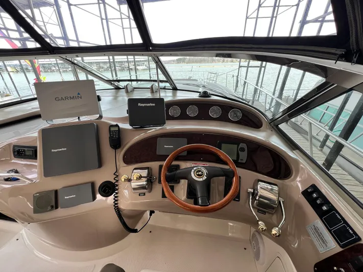  Yacht Photos Pics 2003 Sea Ray 460 Sundancer helm with Garmin and Raymarine navigation systems.