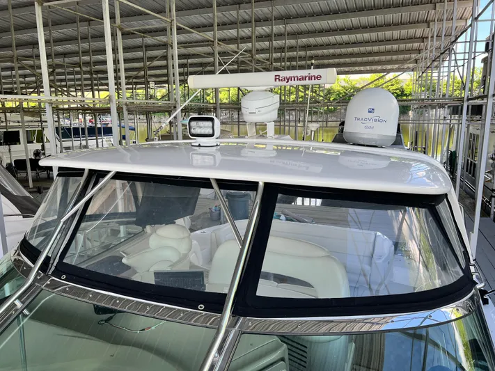  Yacht Photos Pics 2003 Sea Ray 460 Sundancer yacht with Raymarine and TracVision equipment in a covered dock.