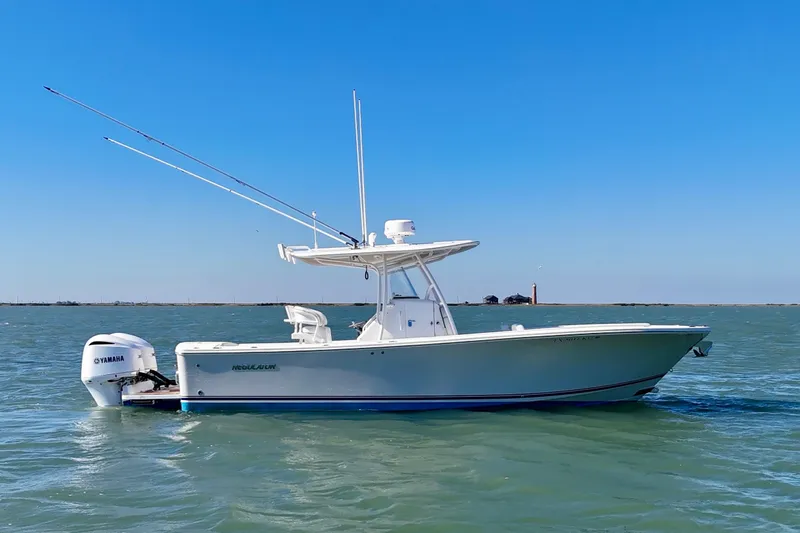  Yacht Photos Pics 2016 Regulator 28 Forward Seating boat on water with Yamaha engine, clear blue sky.