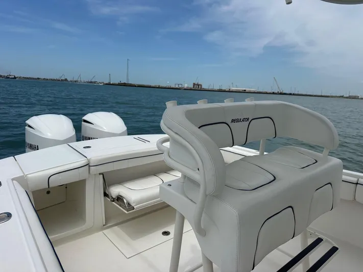  Yacht Photos Pics 2016 Regulator center console boat with Yamaha engines on open water.