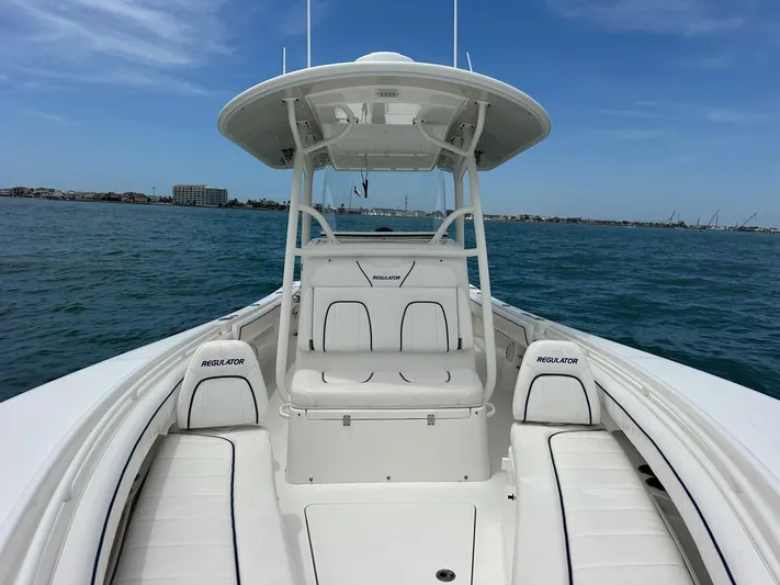  Yacht Photos Pics 2016 Regulator center console boat on open water, clear sky, coastal background.