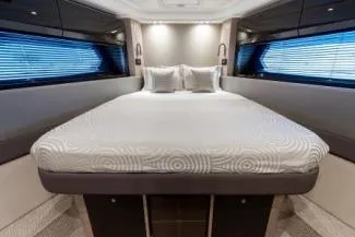  Yacht Photos Pics Luxurious bedroom interior of 2019 Azimut Atlantis 51 yacht with modern design and elegant bedding.
