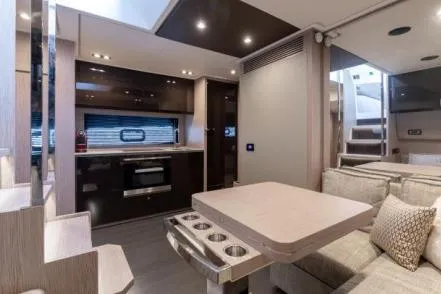  Yacht Photos Pics Luxurious interior of 2019 Azimut Atlantis 51 yacht with modern kitchen and seating area.