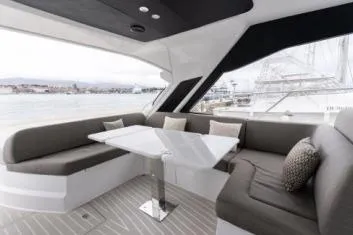  Yacht Photos Pics Luxurious 2019 Azimut Atlantis 51 yacht interior with elegant seating and table.