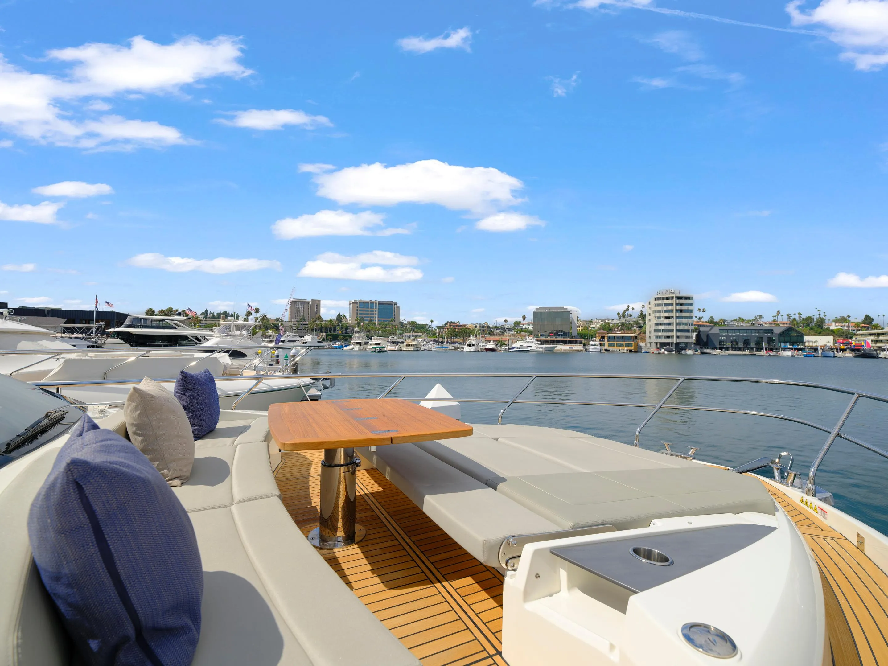 Luxurious 2024 Absolute 60 Fly yacht with spacious deck and waterfront view.