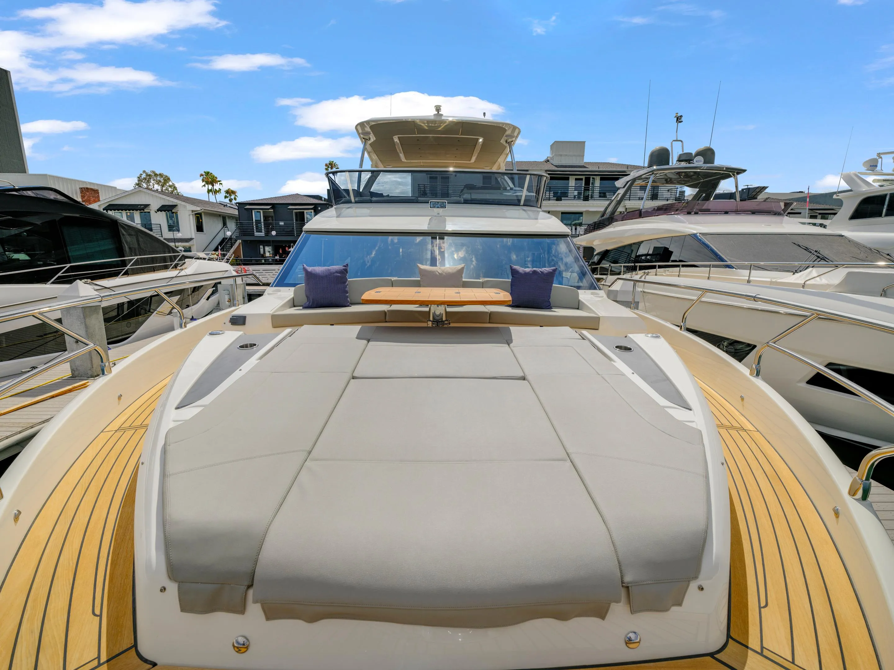 2024 Absolute 60 Fly yacht with sun deck and luxurious seating at marina.