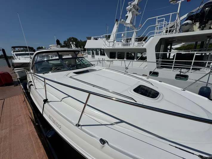  Yacht Photos Pics 2007 Sea Ray 400 Sundancer yacht docked, showcasing sleek design and spacious deck.