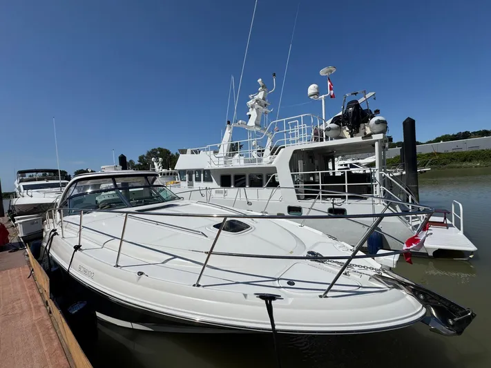  Yacht Photos Pics 2007 Sea Ray 400 Sundancer yacht docked at marina under clear blue sky.