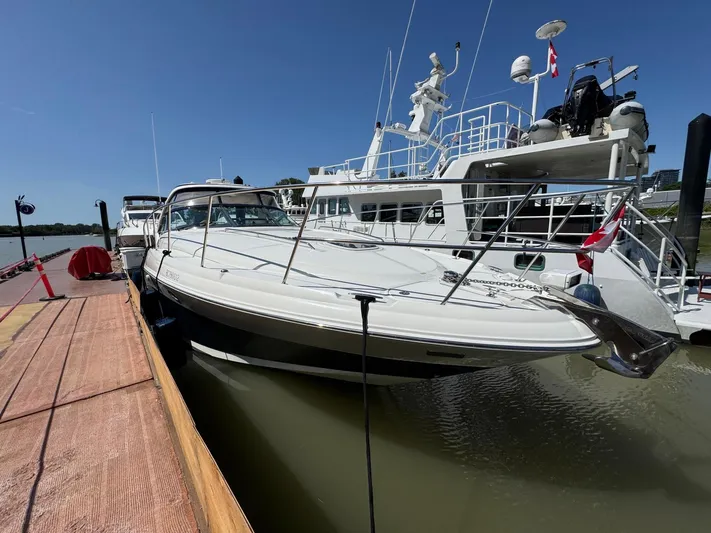  Yacht Photos Pics 2007 Sea Ray 400 Sundancer yacht docked at marina under clear blue sky.