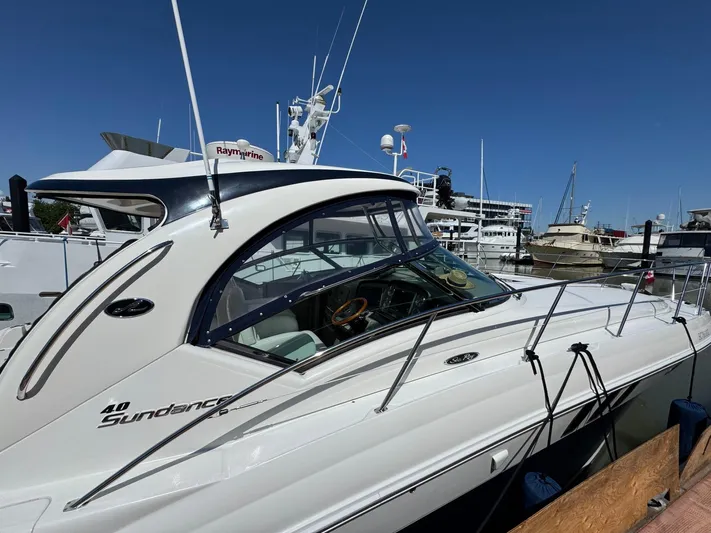  Yacht Photos Pics 2007 Sea Ray 400 Sundancer yacht docked at marina under clear blue sky.