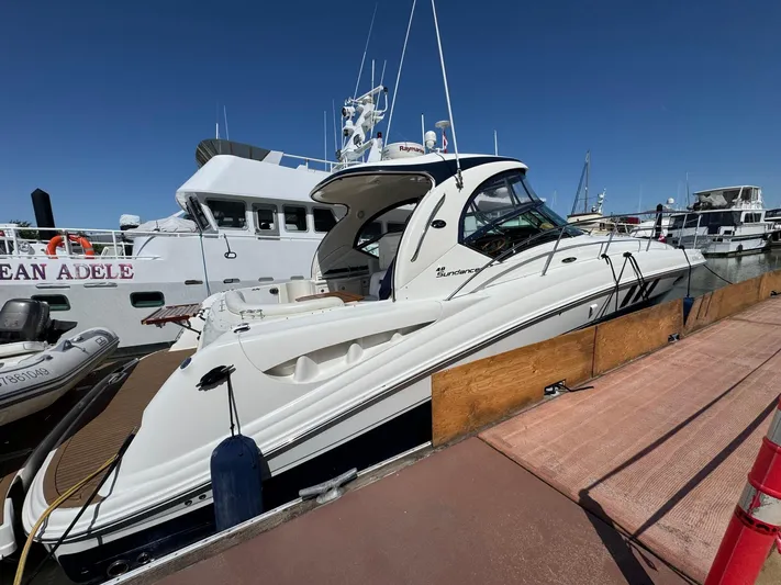  Yacht Photos Pics 2007 Sea Ray 400 Sundancer yacht docked at marina under clear blue sky.