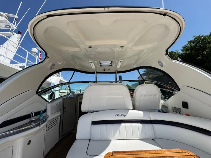  Yacht Photos Pics Interior view of 2007 Sea Ray 400 Sundancer yacht with white seating and open canopy.