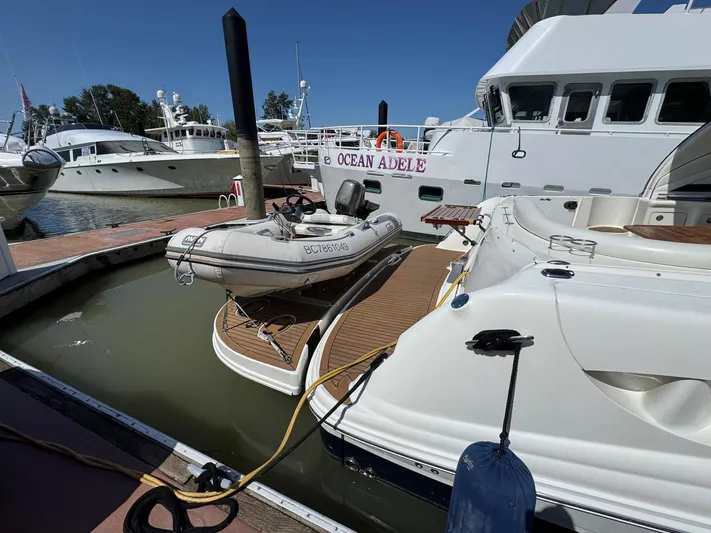 Yacht Photos Pics 2007 Sea Ray 400 Sundancer docked with inflatable boat, sunny marina setting.