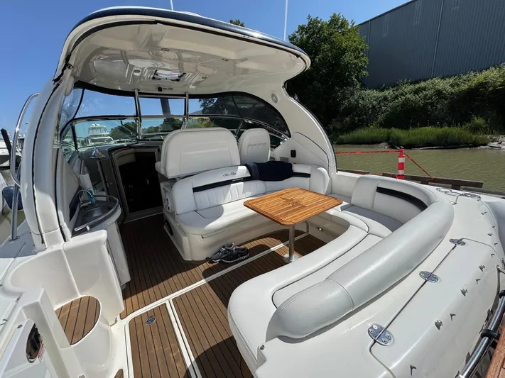  Yacht Photos Pics 2007 Sea Ray 400 Sundancer yacht with spacious seating and wooden table on deck.