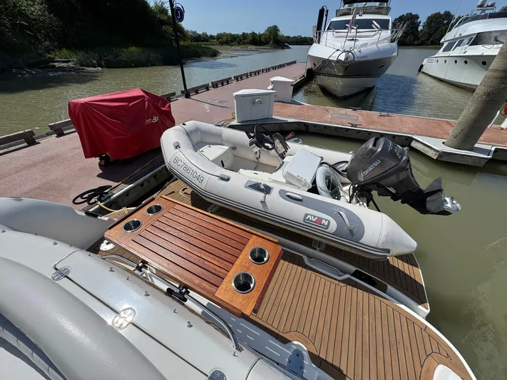  Yacht Photos Pics 2007 Sea Ray 400 Sundancer docked with inflatable boat on wooden deck.