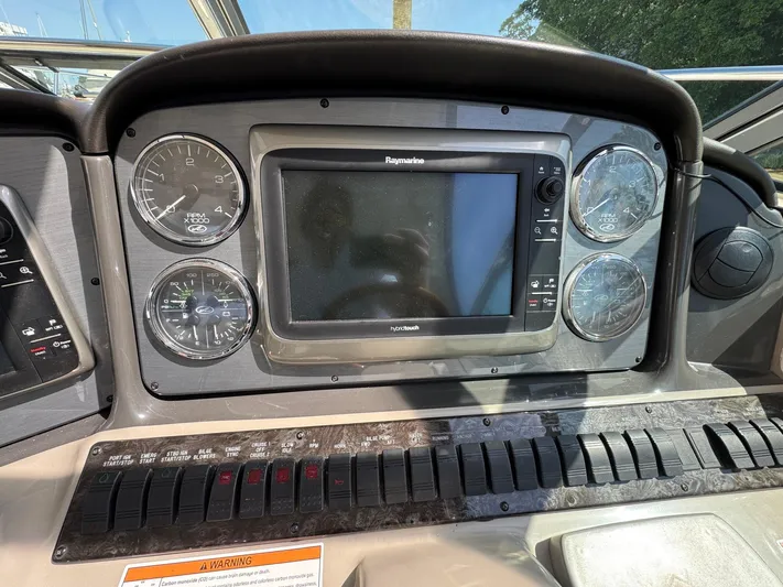  Yacht Photos Pics Dashboard of a 2007 Sea Ray 400 Sundancer with gauges and navigation screen.