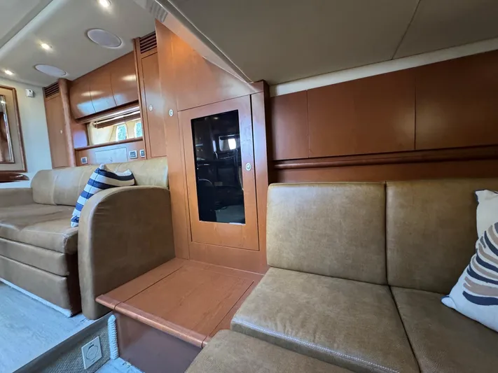  Yacht Photos Pics Interior of 2007 Sea Ray 400 Sundancer with leather seating and wooden cabinetry.