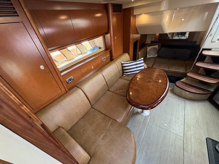  Yacht Photos Pics Luxurious interior of 2007 Sea Ray 400 Sundancer yacht with plush seating and wooden accents.