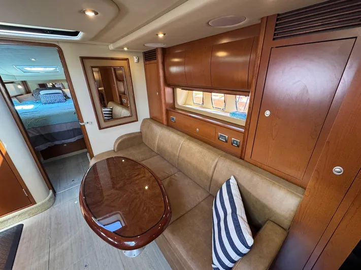  Yacht Photos Pics Luxurious 2007 Sea Ray 400 Sundancer interior with elegant wood finishes and cozy seating area.