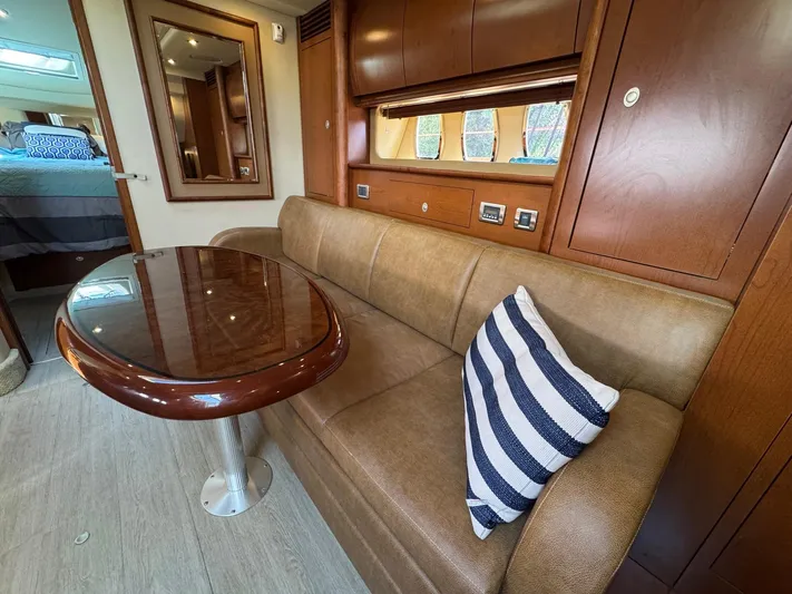  Yacht Photos Pics Interior of 2007 Sea Ray 400 Sundancer with leather sofa and striped pillow.