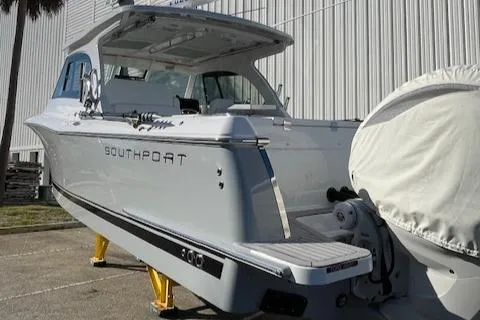 Yacht Photos Pics 2022 Southport 33 DC boat on display, showcasing sleek design and modern features.