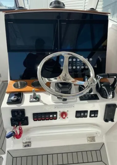  Yacht Photos Pics 2022 Southport 33 DC helm with modern controls and dual screens.