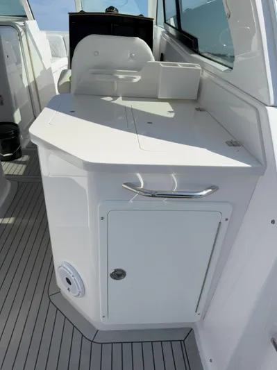  Yacht Photos Pics 2022 Southport 33 DC boat interior with sleek white cabinetry and modern design.