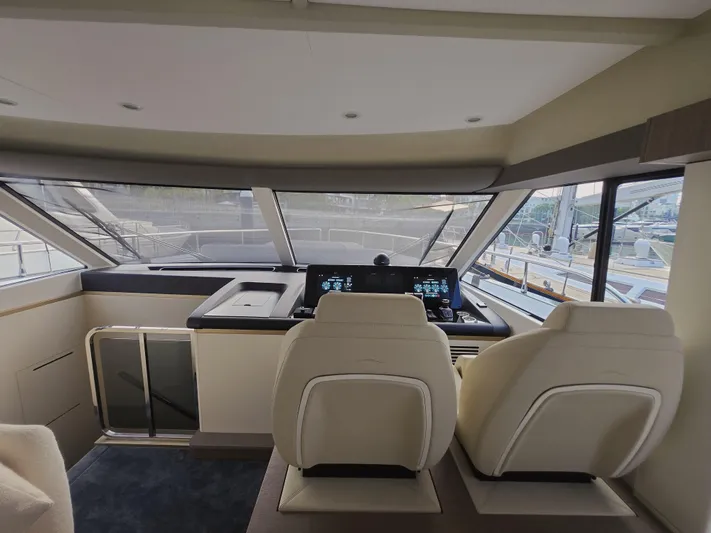  Yacht Photos Pics Interior view of 2024 Azimut Magellano 60 yacht cockpit with modern controls.