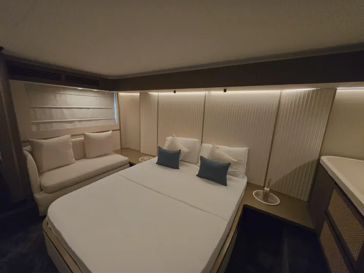  Yacht Photos Pics Luxurious bedroom interior of 2024 Azimut Magellano 60 yacht with modern design.