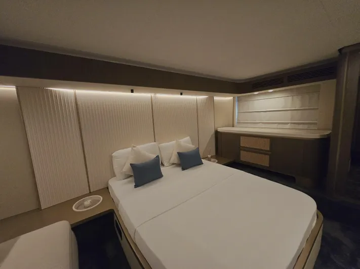  Yacht Photos Pics Luxurious bedroom interior of 2024 Azimut Magellano 60 yacht, featuring elegant design and modern amenities.