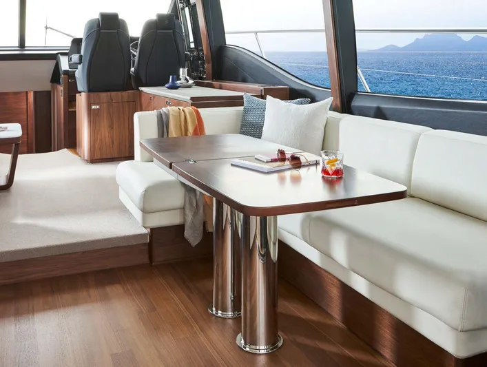  Yacht Photos Pics Luxurious interior of 2025 Princess S65 yacht with ocean view and elegant seating area.