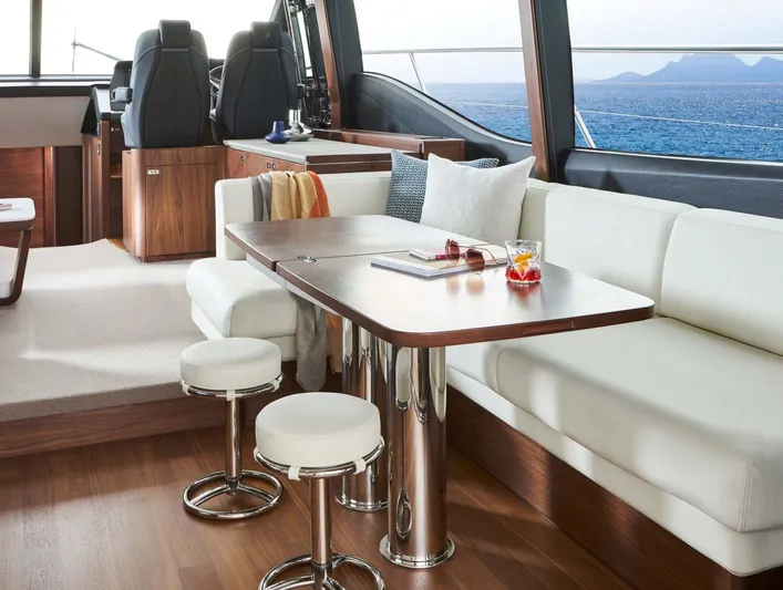  Yacht Photos Pics Luxurious interior of 2025 Princess S65 yacht with elegant seating and ocean view.