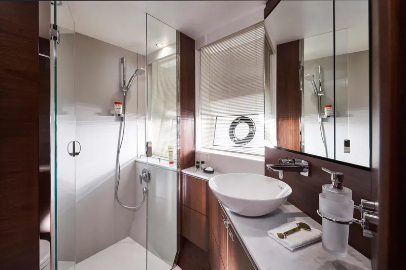  Yacht Photos Pics Luxurious bathroom in 2025 Princess S65 yacht with modern fixtures and elegant design.